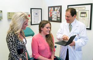 Patient receiving a consultation from Doctor Schlessinger.
